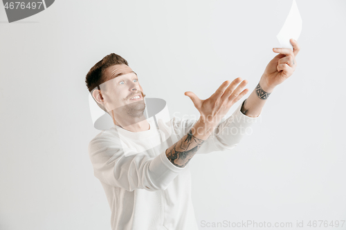 Image of Young man with a surprised expression won a bet