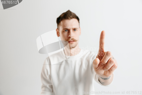 Image of Businessman hand touching empty virtual screen