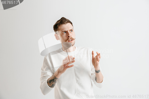 Image of Portrait of the scared man on gray