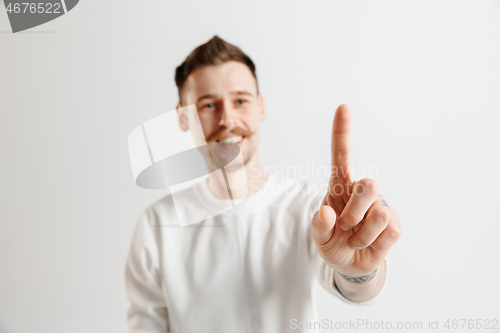 Image of Businessman hand touching empty virtual screen