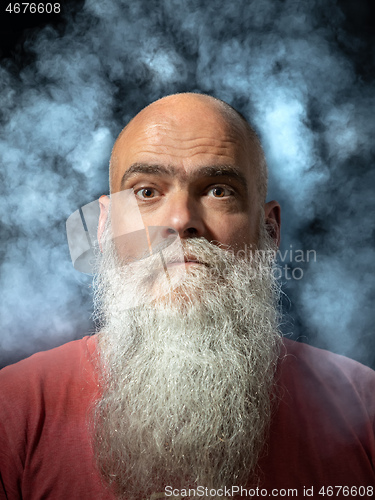 Image of bearded man smoke portrait
