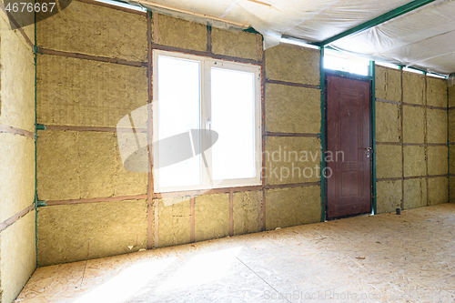 Image of Fragment of the wall of the interior of a country house, the wall is thermally insulated with mineral plates