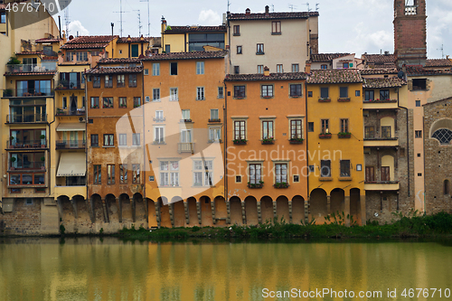 Image of FLORNCE, ITALY - APRIL 24, 2019: View of the historic buildings in Florence. Reflection in the river