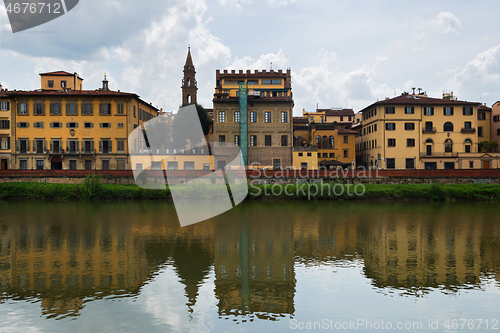 Image of FLORNCE, ITALY - APRIL 24, 2019: View of the historic buildings in Florence. Reflection in the river