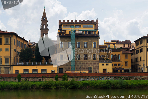 Image of FLORNCE, ITALY - APRIL 24, 2019: View of the historic buildings in Florence. Reflection in the river