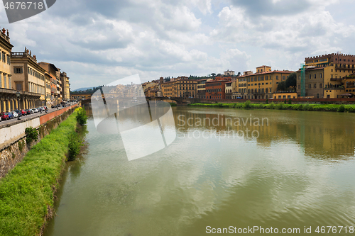 Image of FLORNCE, ITALY - APRIL 24, 2019: View of the historic buildings in Florence. Reflection in the river