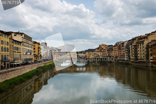 Image of FLORNCE, ITALY - APRIL 24, 2019: Ponte Vecchio. View of the historic buildings in Florence. Reflection in the river