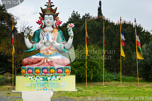 Image of POMAIA, ITALY - APRIL 25, 2019: Statue of Chenrezig in Lama Tzong Khapa Institute in Pomaia, Tuscany, Pomaia,