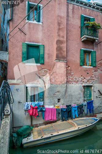 Image of Typical window and boat near a house in Venice