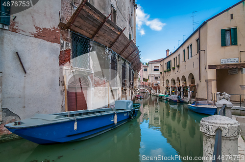 Image of VENICE, ITALY - MAY 23, 2013: Typical canals with old houses