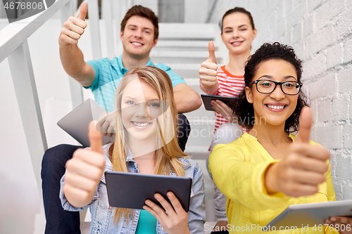 Image of high school students with tablet computers