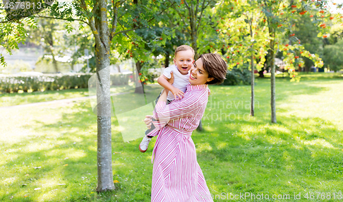 Image of happy mother with little son in summer park
