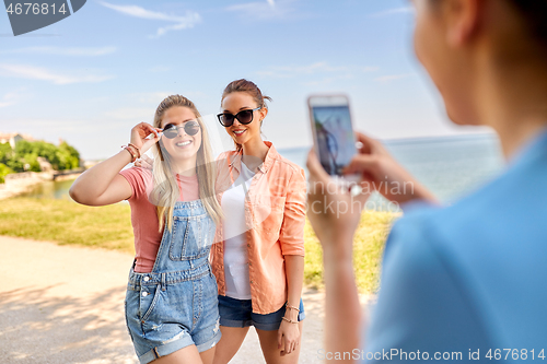 Image of teenage girls or best friends being photographed