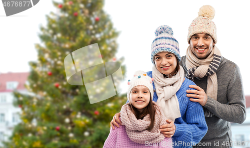 Image of happy family over christmas tree in tallinn