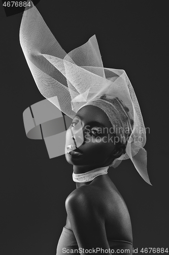 Image of Beautiful african girl with veil hat