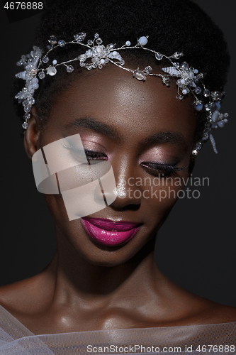 Image of Beautiful black girl with crystal wreath