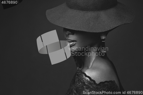 Image of Beautiful girl in black hat