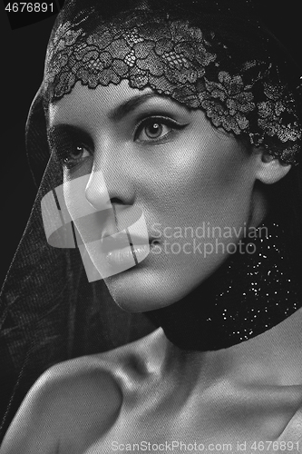 Image of Beautiful girl with black lace veil