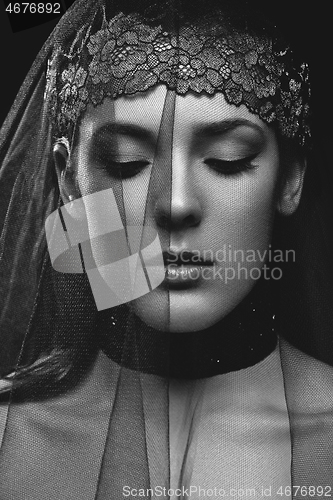 Image of Beautiful girl with black lace veil