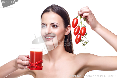 Image of girl with cherry tomatoes and juice 