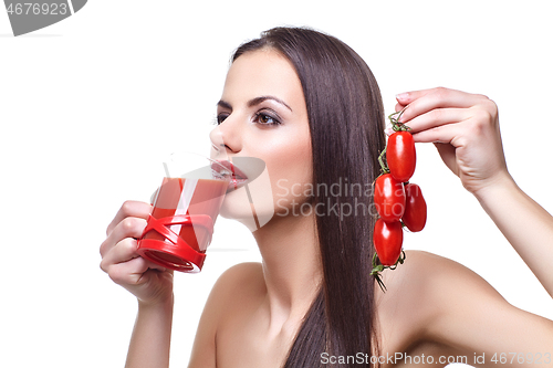 Image of girl with cherry tomatoes and juice 