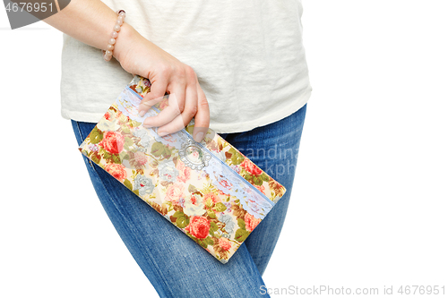 Image of beautiful scrapbooking folder in woman hand