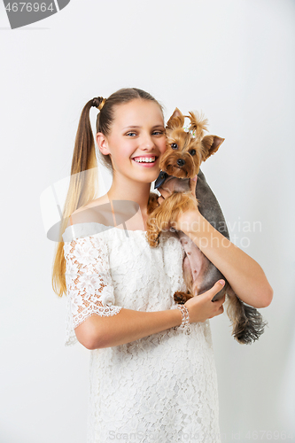 Image of Girl with yorkie dog