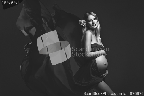 Image of Pregnant girl in red dress