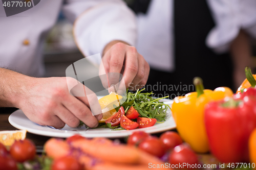 Image of chef serving vegetable salad