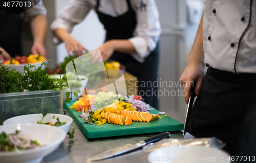 Image of team cooks and chefs preparing meals