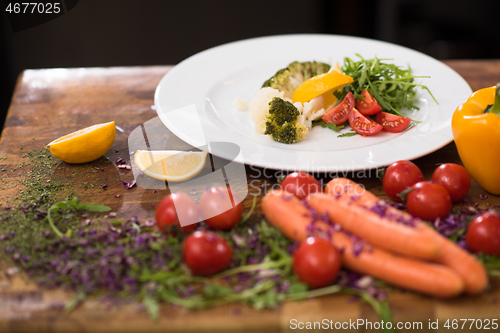 Image of chef serving vegetable salad