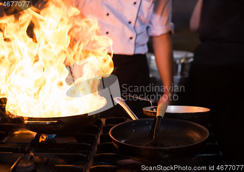 Image of Chef doing flambe on food