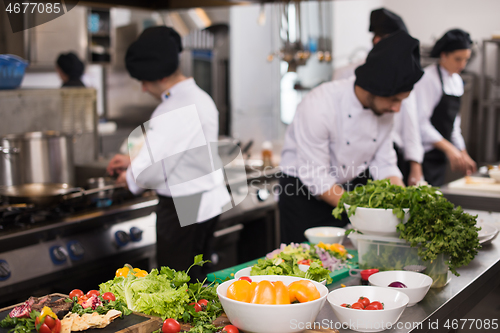 Image of team cooks and chefs preparing meals