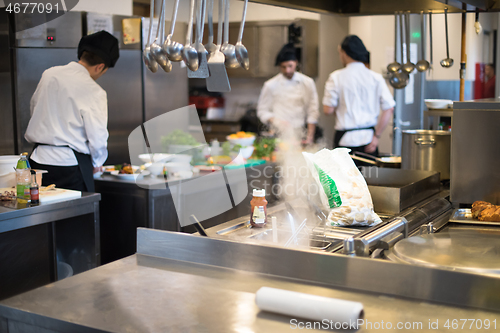 Image of team cooks and chefs preparing meals