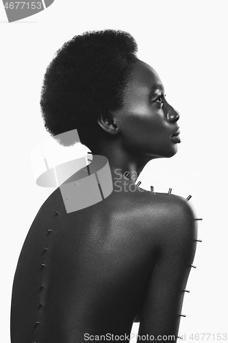 Image of Beautiful black girl with metal pins