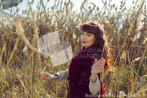 Image of Beautiful girl outdoors in countryside