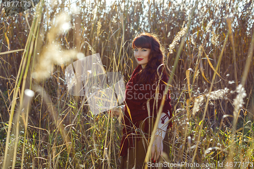 Image of Beautiful girl outdoors in countryside