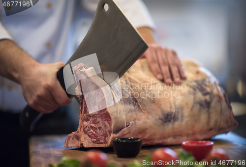 Image of chef cutting big piece of beef