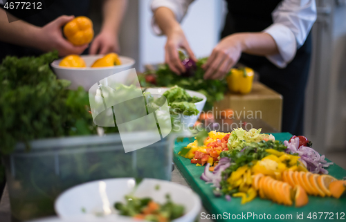 Image of team cooks and chefs preparing meals