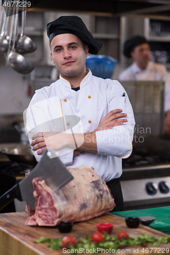 Image of chef cutting big piece of beef