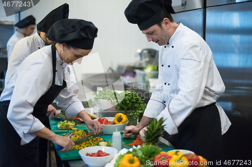 Image of team cooks and chefs preparing meals