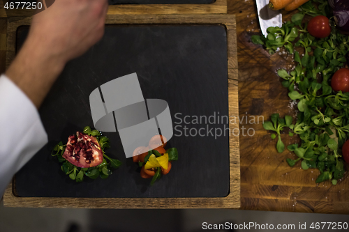 Image of top view of Chef hands serving beef steak