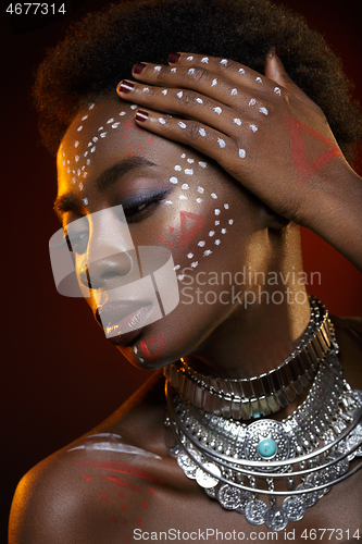 Image of Beautiful afro girl with drawings on skin