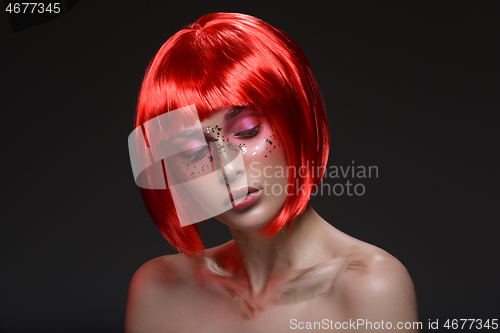 Image of Beautiful girl in red wig