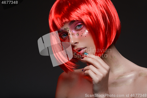 Image of Beautiful girl in red wig