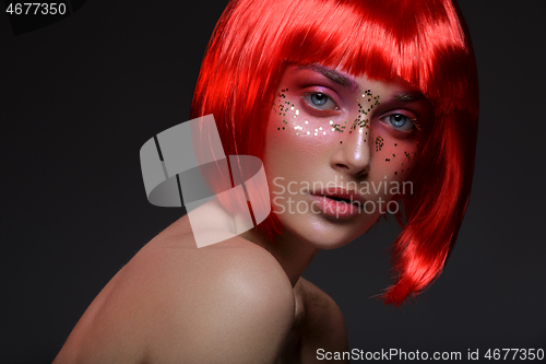 Image of Beautiful girl in red wig