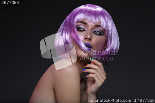 Image of Beautiful girl in purple wig