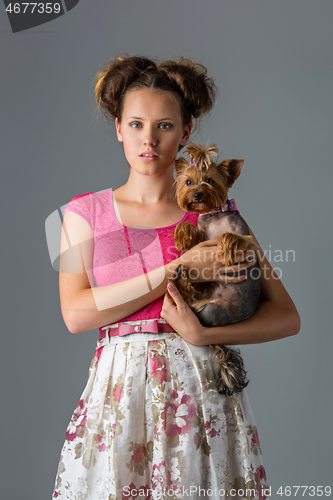 Image of Girl with yorkie dog