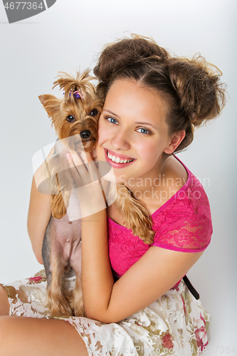 Image of Girl with yorkie dog