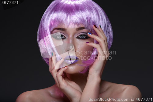 Image of Beautiful girl in purple wig